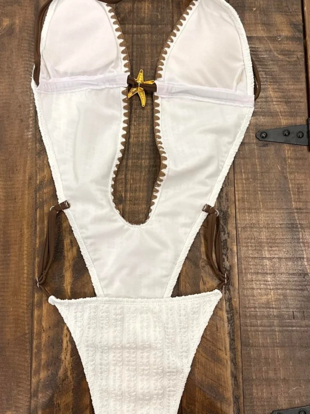 Source Unknown White One-Piece Swimsuit with Brown Trim and Star Accent